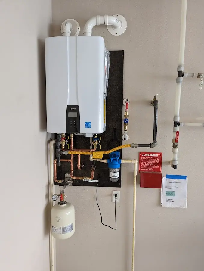 Professional plumber installing copper piping in a Brownwood home